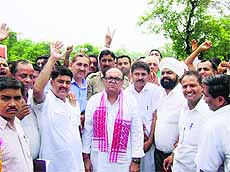 Haryana minister and Congress observer for the Shimla parliamentary seat Capt Ajay Singh Yadav with Congress men at Baddi on Monday.