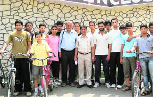 Members of the J&K Cycling Association with the selected players at MA Stadium, Jammu. 