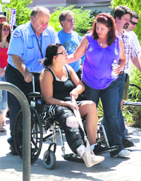 Samantha Yowlers (in a wheelchair) boyfriend Matt McQuinn was killed trying to shield her from a spray of bullets.