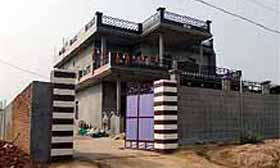The house of Mahinder Singh from where police recovered gold and cash hidden in a pit on Tuesday.