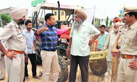 Officials of the Mohali administration with policemen during an anti-encroachment drive on Tuesday. 