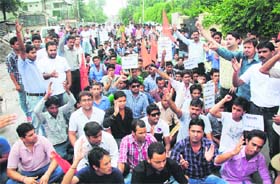 ABVP workers hold a dharna in front of the police headquaters in Dehradun on Tuesday