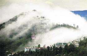 MISTY MAGIC: Dense fog envelops hills in Shimla on Monday evening