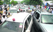 A traffic jam in front of the DC office before the Congress state-level dharna against the in hike power tariff and taxes; and (right) a large number of party workers participate in the dharna in Jalandhar on Tuesday. 