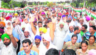 a large number of party workers participate in the dharna in Jalandhar on Tuesday.