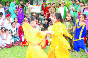 Students of Everest Public school celebrate Teej in Ludhiana on Tuesday. 