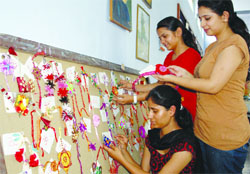 With Raksha Bandhan coming, girls from the fine arts department of Government College for Girls display handmade rakhis during a special exhibition in Amritsar on Tuesday. photo: vishal kumar