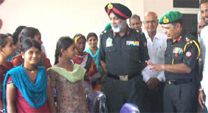Major-General Jagbir Singh and Brigadier Rakesh Raina interact with girl students at the computer centre in Asafwala on Wednesday. 
