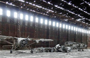 Antique aircraft rust under the worn out roof of the hangar of an erstwhile ruler of Faridkot. 