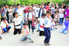Children of Hamari Kaksha stage a play, Koshis Jaari Hai at Plaza in Sector 17, Chandigarh, on Wednesday