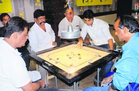 Players in action during a carrom tournament in Panchkula on Wednesday