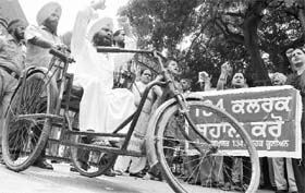 Suspended clerks protest against the Punjab government in Mohali on Wednesday