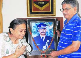 Harbans Lal and Raksha Devi with the photograph of their son Sandeep Sagar