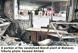 A portion of the vandalised Maruti plant at Manesar. Tribune photo: Sayeed Ahmed