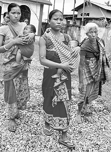 Bodo women walk through a relief camp at Kokrajhar, some 230km from Guwahati, on Wednesday. 