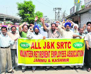 The All-J&K SRTC Volunteer Retirement Employees Association stages a protest outside the Exhibition Ground on Wednesday.