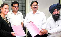 Armi Cortes, owner of a Philippines-based company, signs a pact with Mayor Rakesh Rathour and Commissioner Viney Bublani in Jalandhar on Wednesday