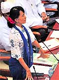 Aung San Suu Kyi speaks during a regular session in Parliament