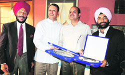 Golfers Jeev Milkha Singh (second from left) and Sujjan Singh (extreme right) with CGA president CSR Reddy and Milkha Singh at a function in Chandigarh on Thursday. Tribune photo: parvesh chauhan