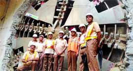 Metro officials with the tunnel boring machine in New Delhi on Thursday.