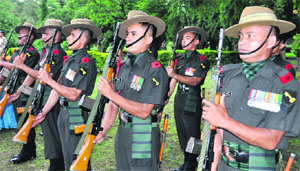 A contingent of Army jawans pays homage to the Kargil martyrs at a function in Dehradun on Thursday.