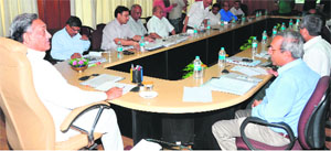 Chief Minister Vijay Bahuguna holds a meeting to review works of the PWD in Dehradun on Thursday.