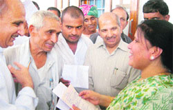 Education Minister Geeta Bhukkal listens to public grievances at her residence in Jhajjar. Photo: Manoj Dhaka