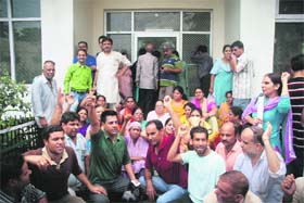 Kashmiri Pandits stage a protest in front of the Relief Commissioners Office in Jammu on Thursday