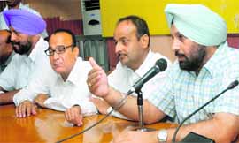 Congress councillors hold a press conference against MC authorities for taking decisions without the consent of the House in Jalandhar on Friday. 