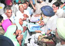 Chief Minister Parkash Singh Badal during a Sangat Darshan at Talwara in Hoshiarpur on Friday. 