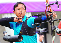Tarundeep Rai competes during the ranking round of the men's archery individual event at the Lord's Cricket Ground in London on Friday.  AFP 