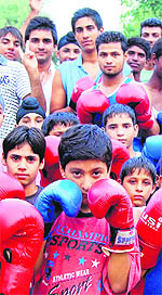 A number of budding boxers gather at the Boxing Training Centre on the Khalsa College Senior Secondary School campus, under aegis of the Amritsar Amateur Boxers Association, to pray for Vijender Singh and Shiv Thapas success. Their Olympic mathces are scheduled on Sunday