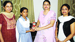 Rupa being honoured at her school