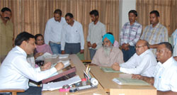 District and Sessions Judge, SK Aggarwal, talking to litigants during the monthy Lok Adalat held at the District Courts in Bathinda on Saturday. A Tribune photograph