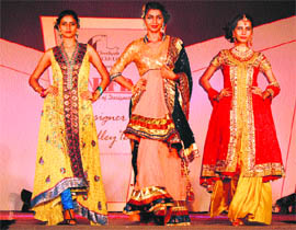 Models sashay down the ramp during the Designer Medley-12, a fashion show of INIFD, in Chandigarh on Saturday. 