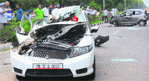 The damaged cars after the accident on Madhya Marg on Saturday.  