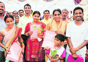 Residents with the possession letters of flats built under a slum rehabilitation scheme, at a function in Chandigarh on Saturday. 