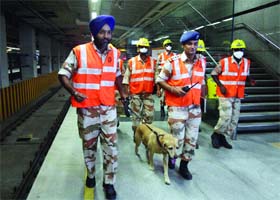 Rescue workers from the Delhi Disaster Management Authority (DDMA) during a mock drill to combat emergency incidents at the Central Secretariat Metro station in New Delhi on Saturday