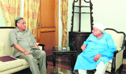 Chief Minister Vijay Bahuguna meeting Governor Aziz Qureshi in Dehradun on Saturday. 