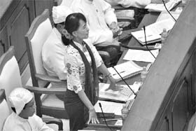 Myanmars Opposition leader Aung San Suu Kyi asks a question in the Lower House of Myanmar Parliament on July 25 in Naypyitaw