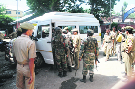 Security personnel inspect a vehicle after an explosion left three tourists dead and five injured in Bijbehara town of Anantnag district on Saturday.