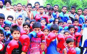 A number of budding boxers gather at the Boxing Training Centre on the Khalsa College Senior Secondary School campus, under aegis of the Amritsar Amateur Boxers Association, to pray for Vijender Singhs success at the Olympic Games, in Amritsar on Saturday.