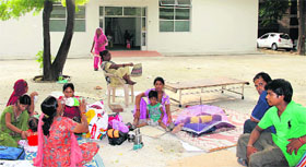 Attendants of patients at the newly opened maternity wing of the Civil Hospital, Jalandhar,have to sit outside as they are allowed to wait even in the corridors.