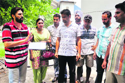 Coaches protest at Guru Nanak Stadium in Ludhiana on Saturday. Tribune Photo: himanshu mahajan