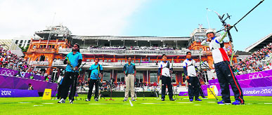 JapansTakaharu Furukawa (R) shoots the arrow as he competes in the men's team archery eliminations match against India at the Lord's Cricket Ground in London on Saturday.