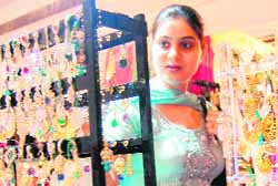 Women check out clothes and jewelleries at the exhibitions in Amritsar. 