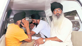 Sewadars being taken to the police station for investigation in Chandigarh on Sunday.