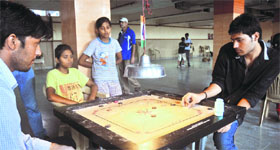 Players in action during a carrom tournament at St Stephens School, Sector 45, in Chandigarh on Sunday.