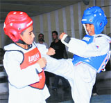 Tae-kwon-do bout in progress during a state championship at skating rink of Sector 10, Chandigarh, on Sunday.