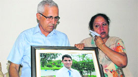 The parents of Alok Gupta, a resident of Sector 21, Panchkula, who was shot on Christmas eve in Canada last year.
